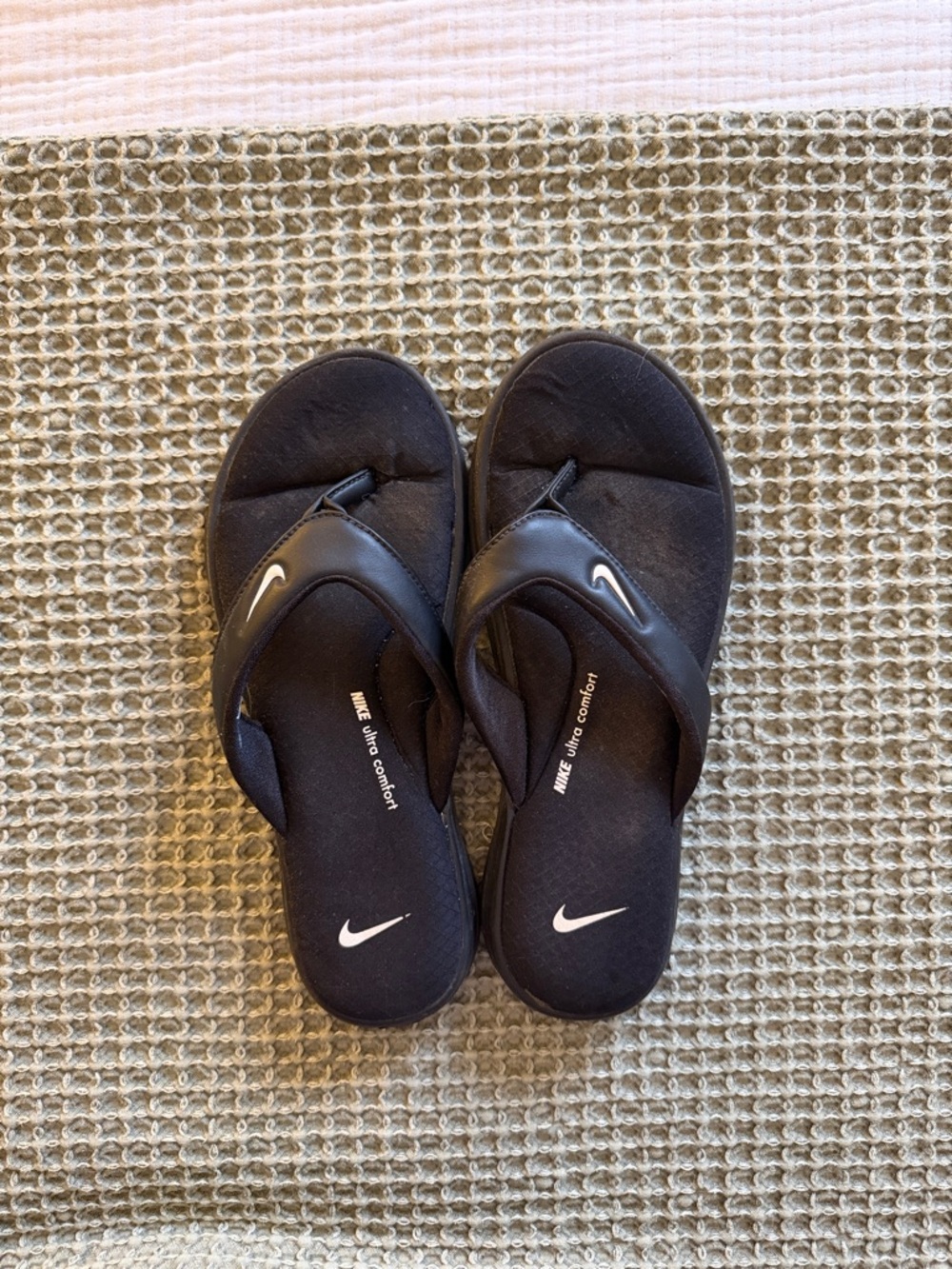 Nike Black Flip Flop Sandals with White Swoosh Accent